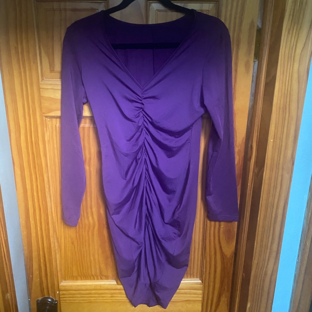 Sexy purple bodycon dress with mid rushing. Worn once.